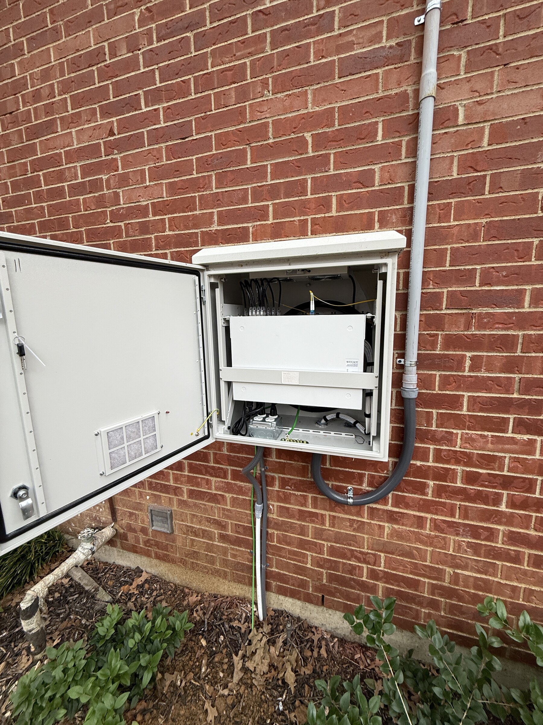Exterior IDF enclosure installed on a multifamily building in Euless, Texas